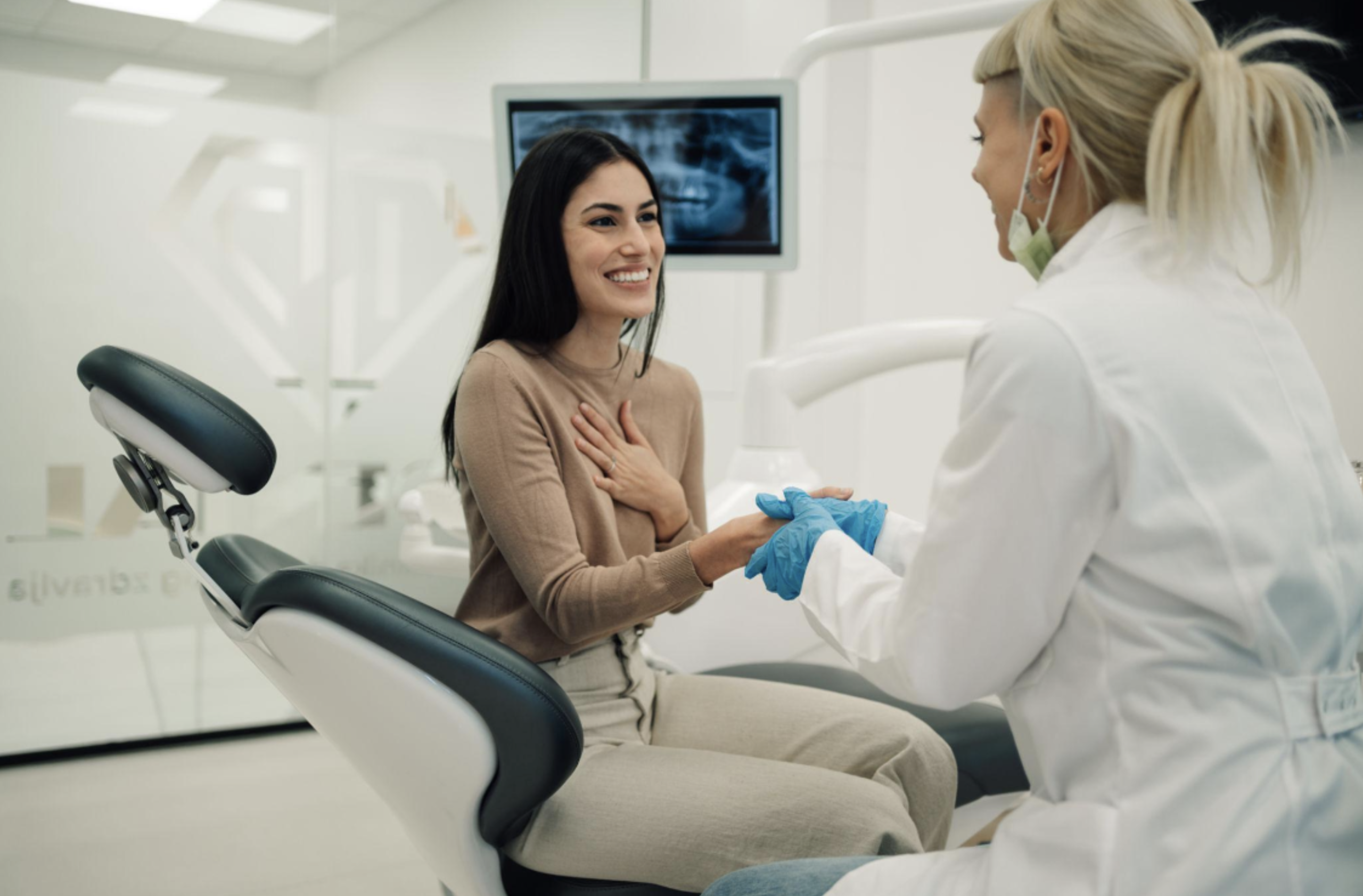 Female and dentist treating a dental emergency on the Sunshine Coast